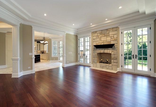 rich, warm-toned hardwood floors in a rustic cabin